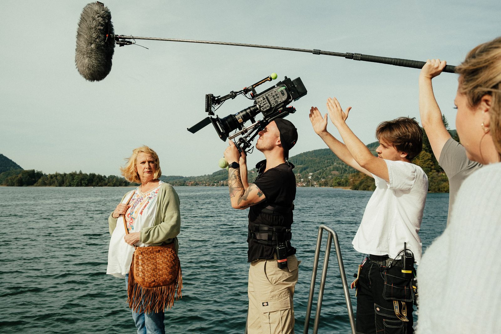 on location at the lake: shoulder-mounted camera, boom and actress in the water